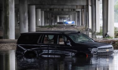 An abandoned car sits submerged in flood waters near the Fort Lauderdale-Hollywood International Airport in Fort Lauderdale