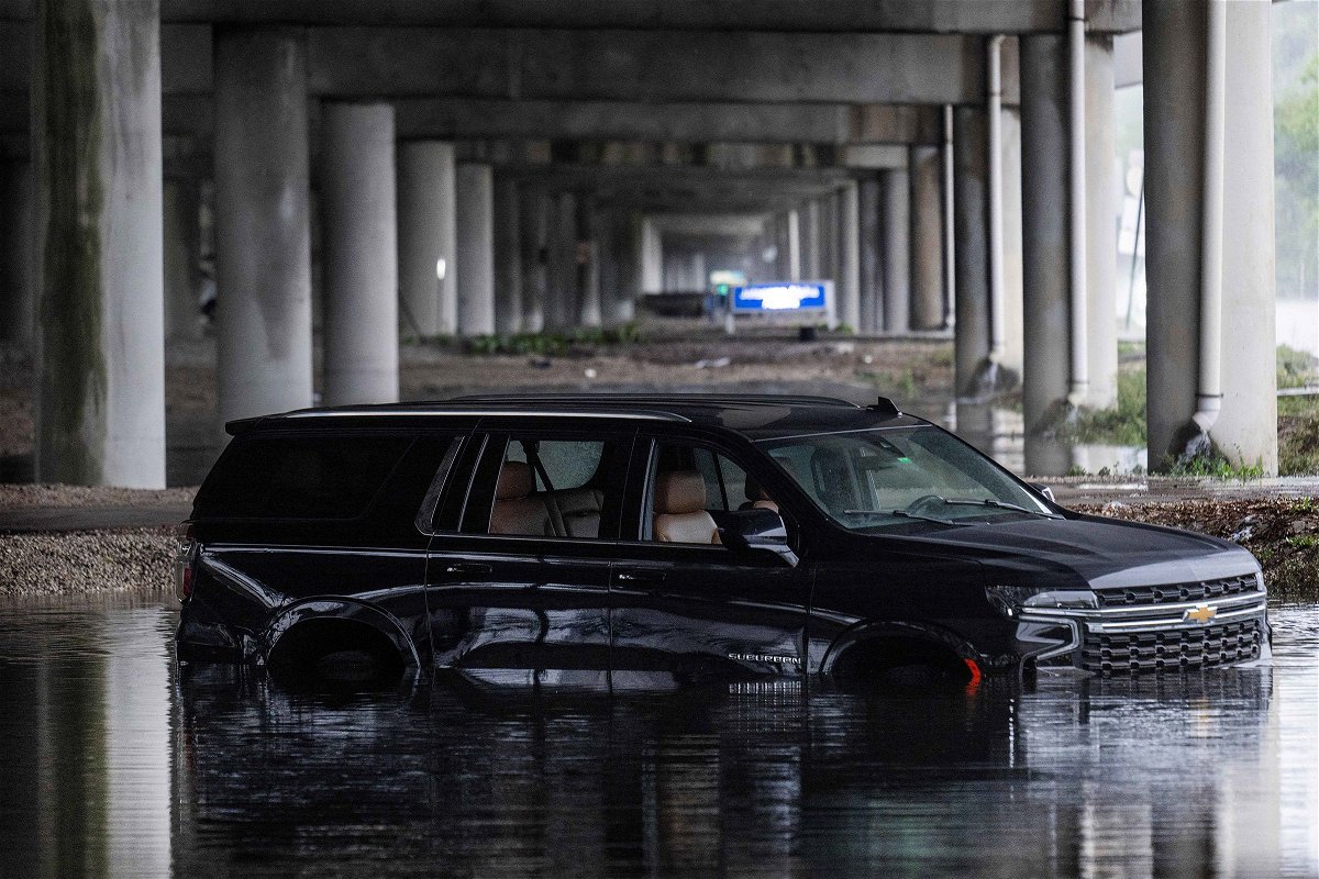 <i>Jim Watson/AFP/Getty Images via CNN Newsource</i><br/>An abandoned car sits submerged in flood waters near the Fort Lauderdale-Hollywood International Airport in Fort Lauderdale