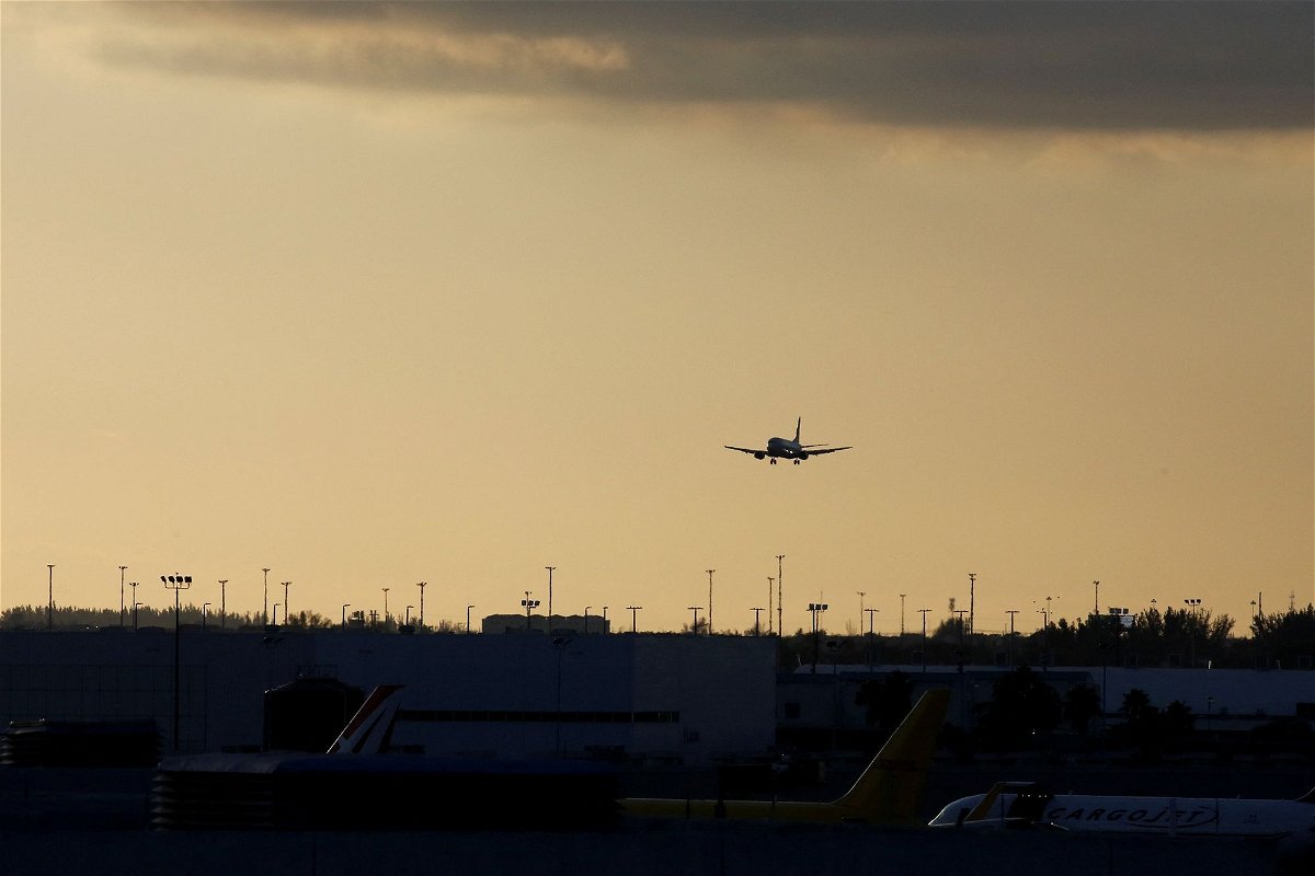 <i>Marco Bello/Reuters via CNN Newsource</i><br/>An aircraft approaches to land at Miami International Airport.