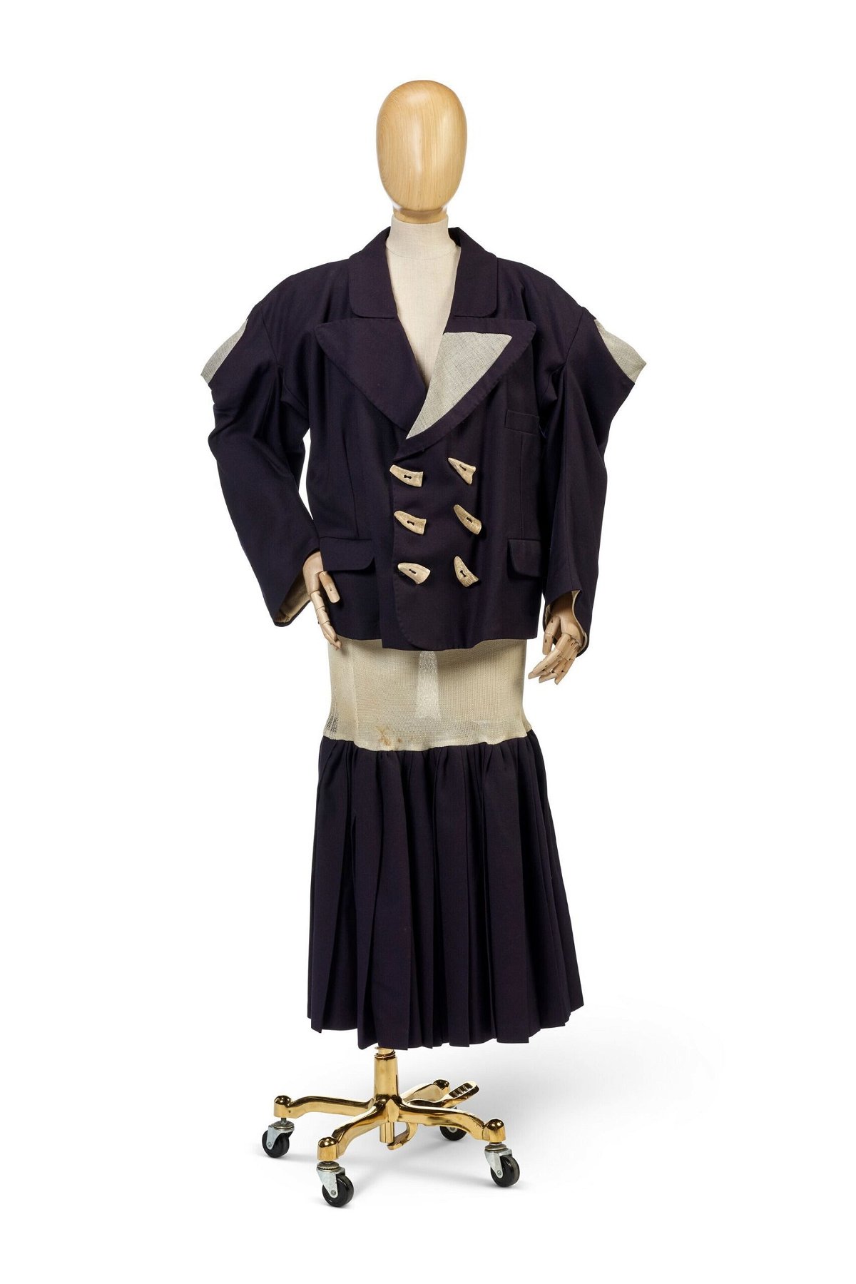 <i>Courtesy Christie's via CNN Newsource</i><br/>A two-piece navy blue ensemble from her early 