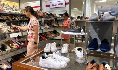 People shop for shoes in a store at The Village at Corte Madera on May 30