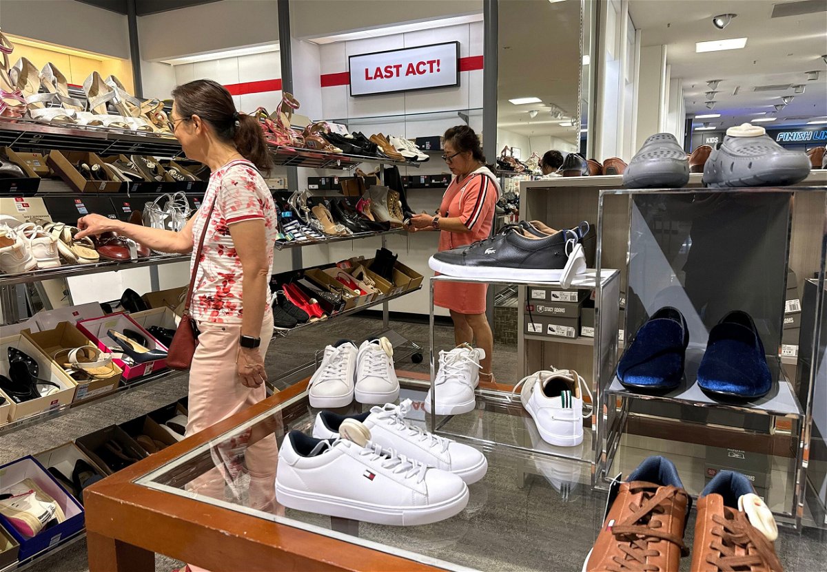 <i>Justin Sullivan/Getty Images via CNN Newsource</i><br/>People shop for shoes in a store at The Village at Corte Madera on May 30