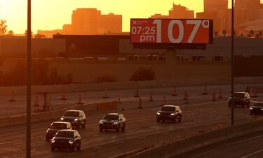 A billboard shows the current temperature in Phoenix