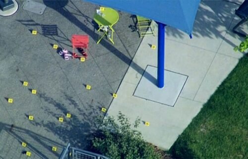 Evidence markers are placed at the scene of a shooting at a splash pad in Rochester Hills