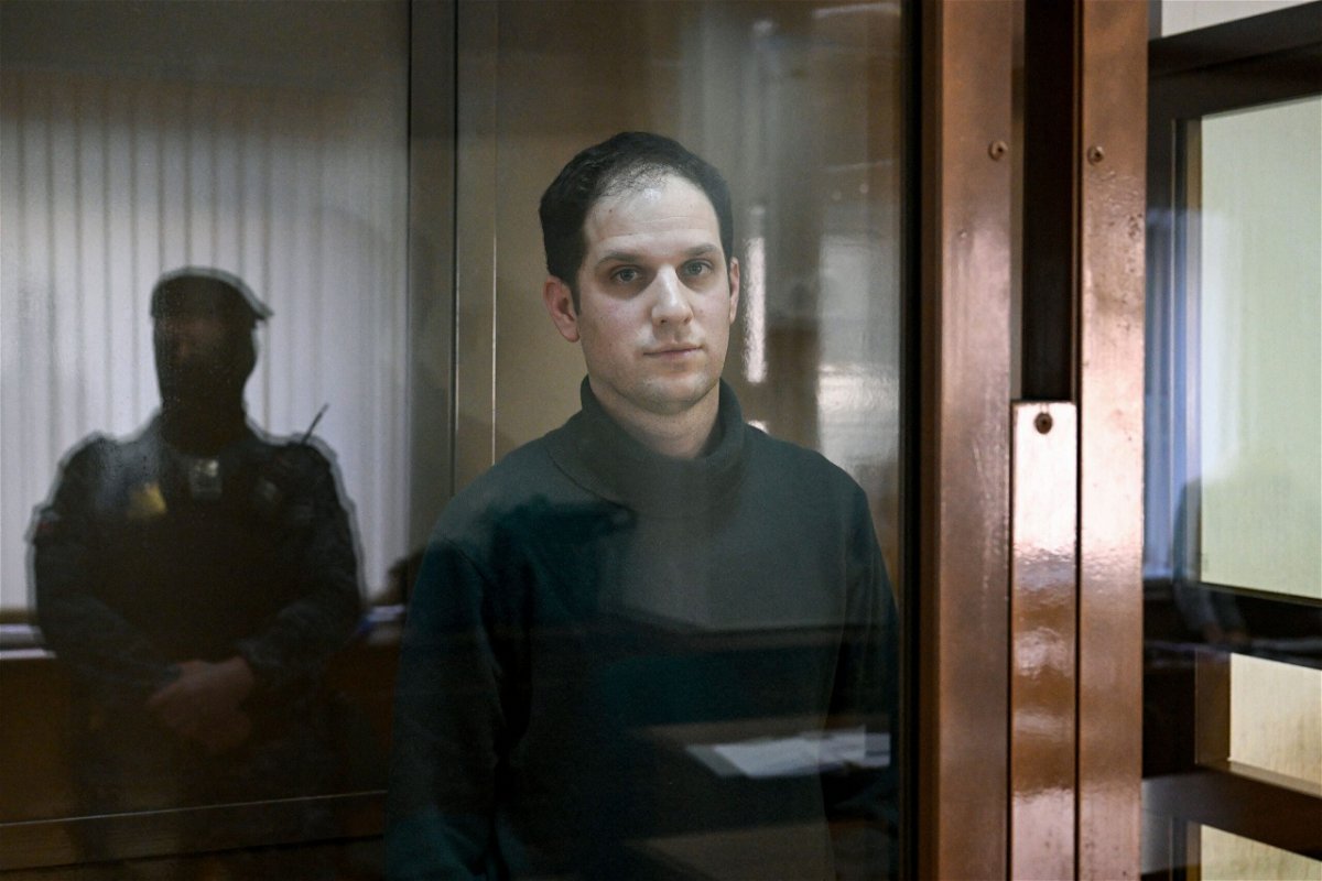 <i>Natalia Kolesnikova/AFP/Getty Images via CNN Newsource</i><br/>Evan Gershkovich looks out from a defendants' box before a hearing at the Moscow City Court in Moscow