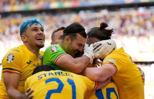 Romania's players celebrate during their victory against Ukraine on June 17.