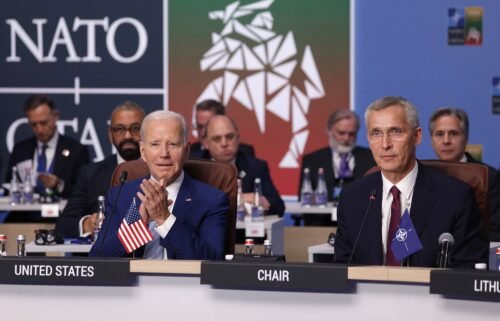 NATO Secretary General Jens Stoltenberg (R) and U.S. President Joe Biden attend the opening high-level session of the 2023 NATO Summit in July 2023 in Vilnius