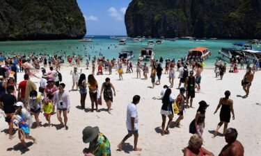 This 2018 photo shows tourists swarming Thailand's Maya Bay