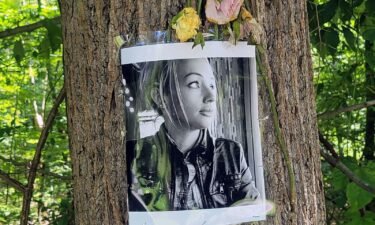 A memorial for Rachel Morin is displayed on a tree on the Ma & Pa Trail in Bel Air