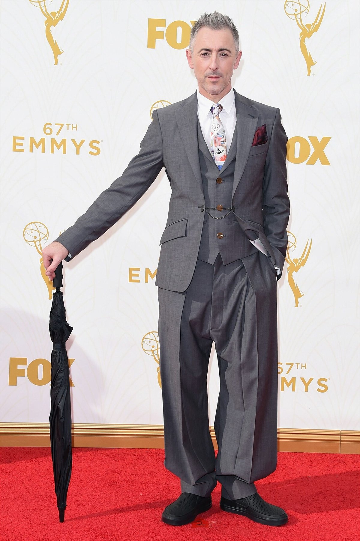 <i>Jason Merritt/Getty Images via CNN Newsource</i><br/>Alan Cumming attends the 67th Primetime Emmy Awards in a Vivienne Westwood suit and black Crocs.