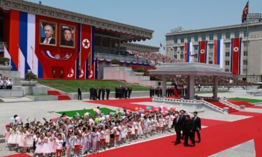 Russia's President Vladimir Putin and North Korea's leader Kim Jong Un attend an official welcoming ceremony at Kim Il Sung Square in Pyongyang