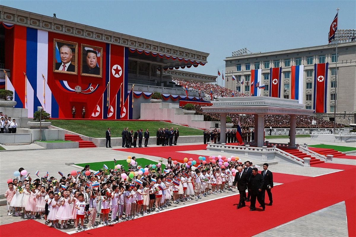 <i>Vladimir Smirnov/Sputnik/Pool/Reuters via CNN Newsource</i><br/>Russia's President Vladimir Putin and North Korea's leader Kim Jong Un attend an official welcoming ceremony at Kim Il Sung Square in Pyongyang