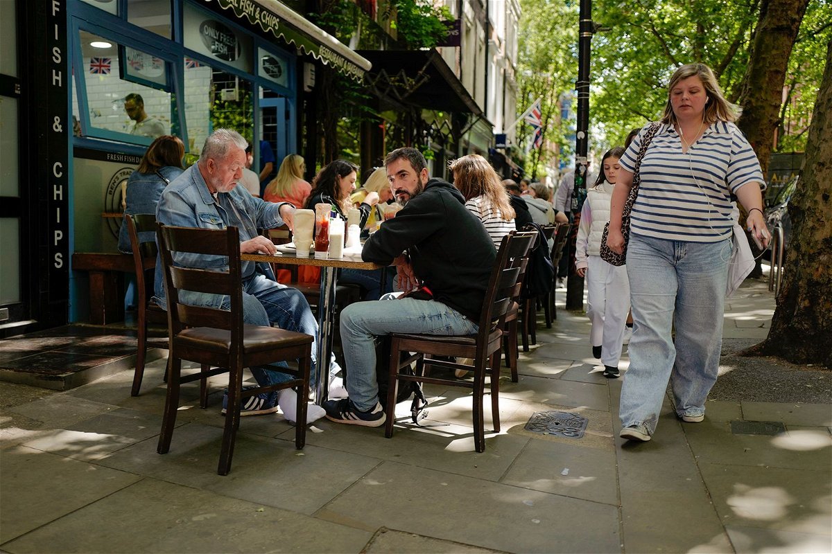 <i>Alberto Pezzali/AP via CNN Newsource</i><br/>A restaurant in Covent Garden in London is pictured on June 17. UK inflation slowed to 2% in May.