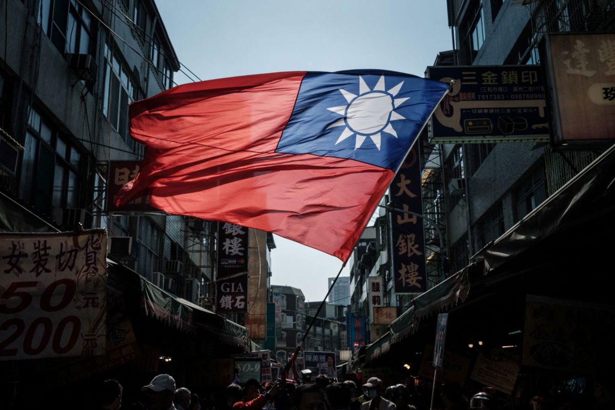 <i>Yasuyoshi Chiba/AFP/Getty Images via CNN Newsource</i><br/>Taiwan's flag seen at a market in Kaohsiung on January 10