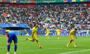 Ukraine's Mykola Shaparenko celebrates scoring his side's equalizing goal.
