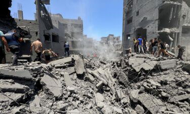 Palestinians search for casualties in Gaza City.