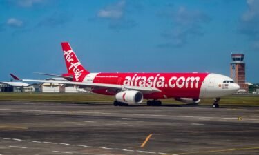 An Airasia passenger plane prepares for take-off at the I Gusti Ngurah Rai International Airport in Denpasar on Indonesia's resort island of Bali in May 2023.