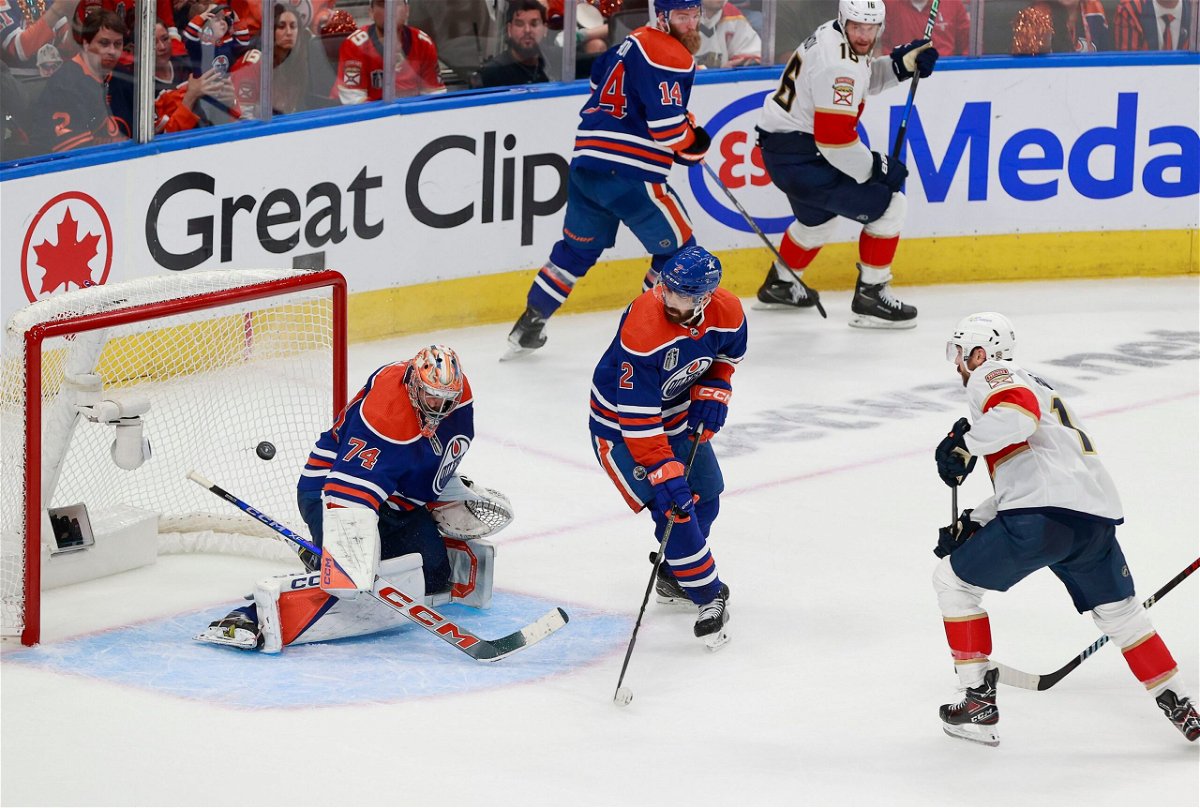 <i>Jeff Vinnick/Getty Images via CNN Newsource</i><br/>Edmonton's Stuart Skinner (left) makes a save from Florida's Sam Reinhart during Game 6 of the Stanley Cup Final.