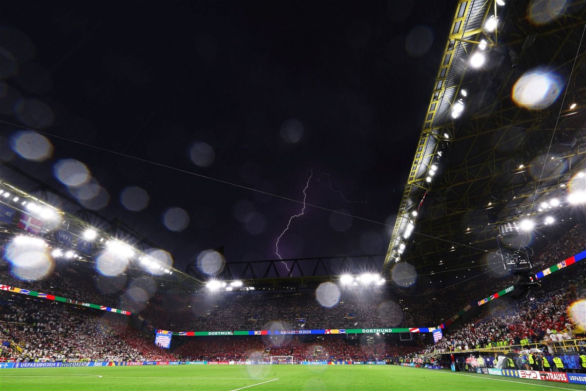 <i>Alexander Hassenstein/Getty Images via CNN Newsource</i><br/>Lightning is seen above BVB Stadion during the Euro 2024 game between Germany and Denmark.