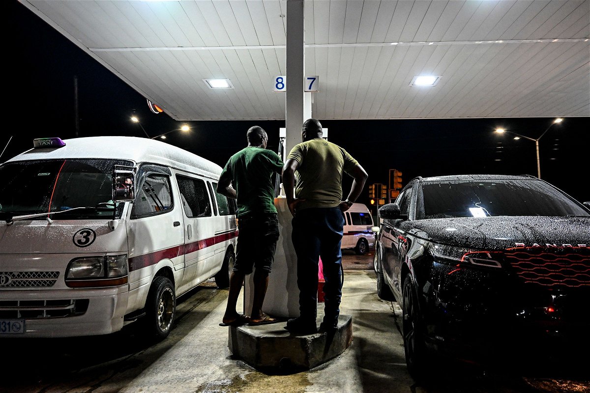 <i>Chandan Khanna/AFP/Getty Images via CNN Newsource</i><br/>Cars line up at a gas station Saturday in Bridgetown