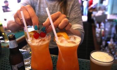 A bartender at Wipeout Bar & Grill makes cocktails on June 21