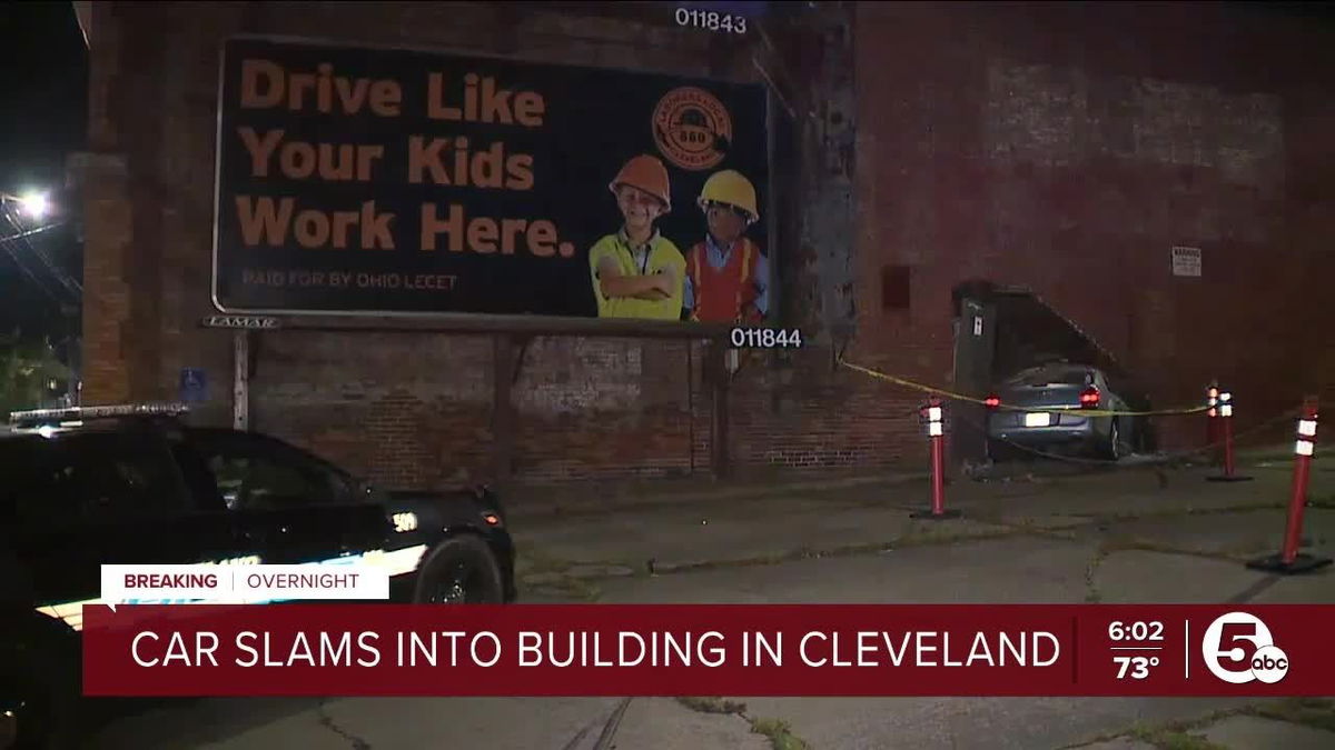 <i>WEWS via CNN Newsource</i><br/>A car crashed into a building on Cleveland's east side right under a billboard that reads