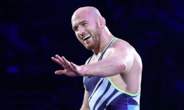 U.S. wrestler Kyle Snyder waves to his family