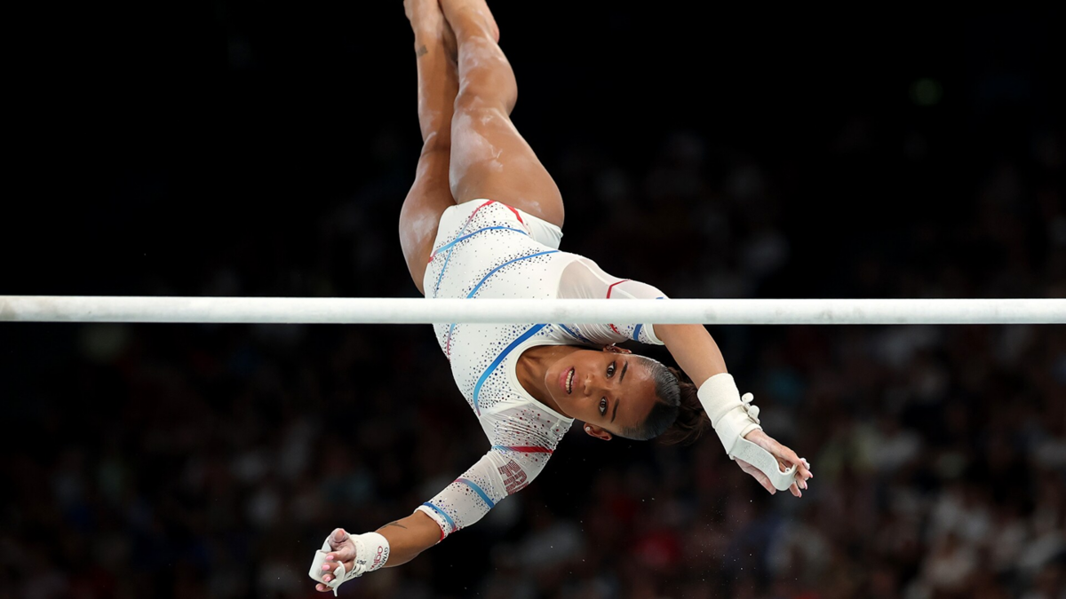 Melanie de Jesus dos Santos of France competes on the uneven bars during the women's qualification round at the 2024 Paris Olympics.