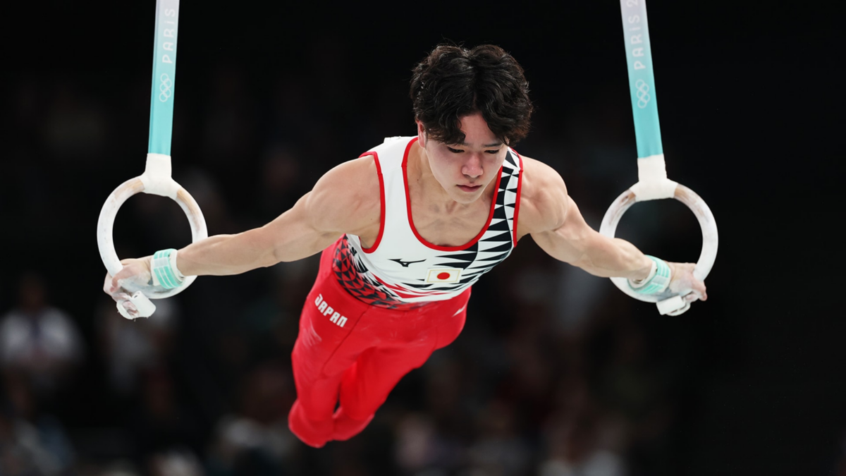 Shinnosuke Oka of Japan competes on the rings during the all-around final at the 2024 Paris Olympics.