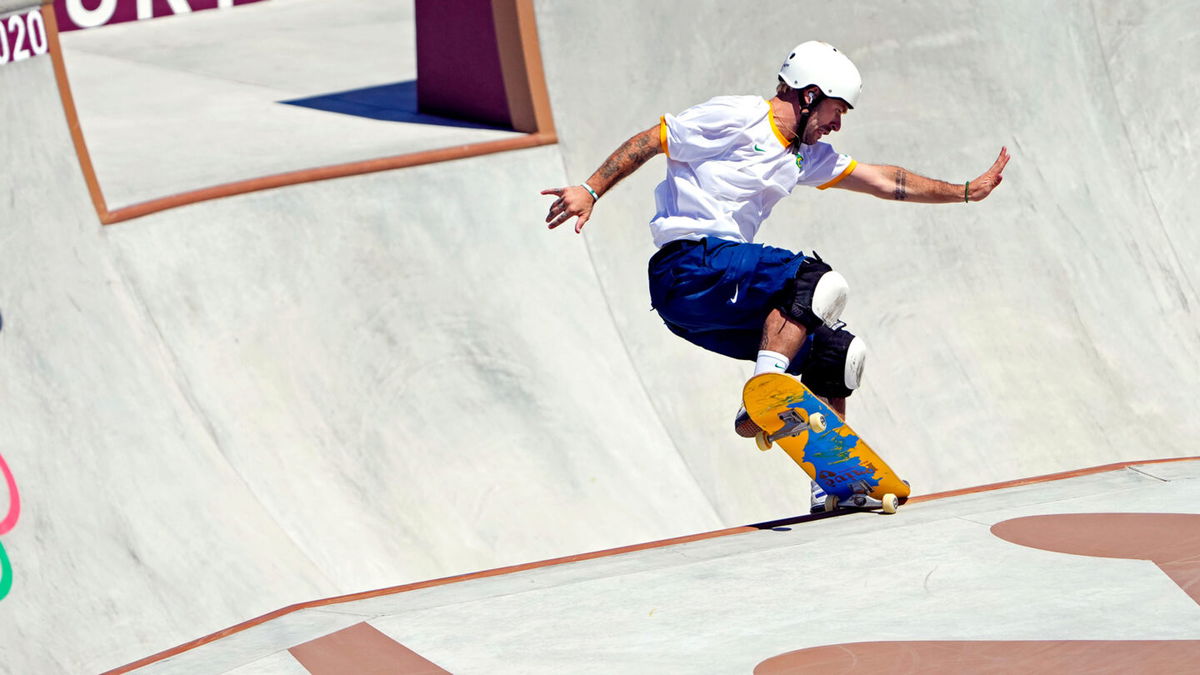 Pedro Barros grinds his skateboard on the lip of the Olympic park course