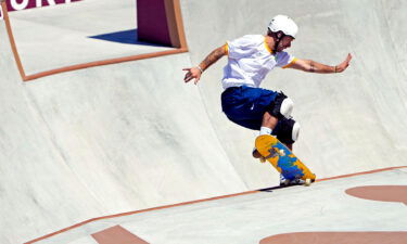 Pedro Barros grinds his skateboard on the lip of the Olympic park course