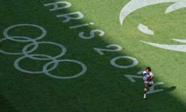 A rugby player on the pitch.
