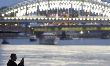 A spectator at the Seine River during the Opening Ceremony