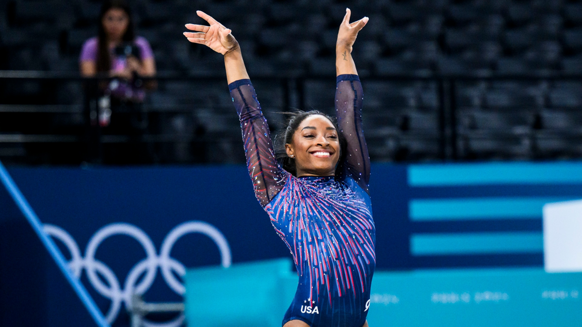 Simone Biles salutes with a smile during podium training session ahead of the Paris 2024 Olympics Games.