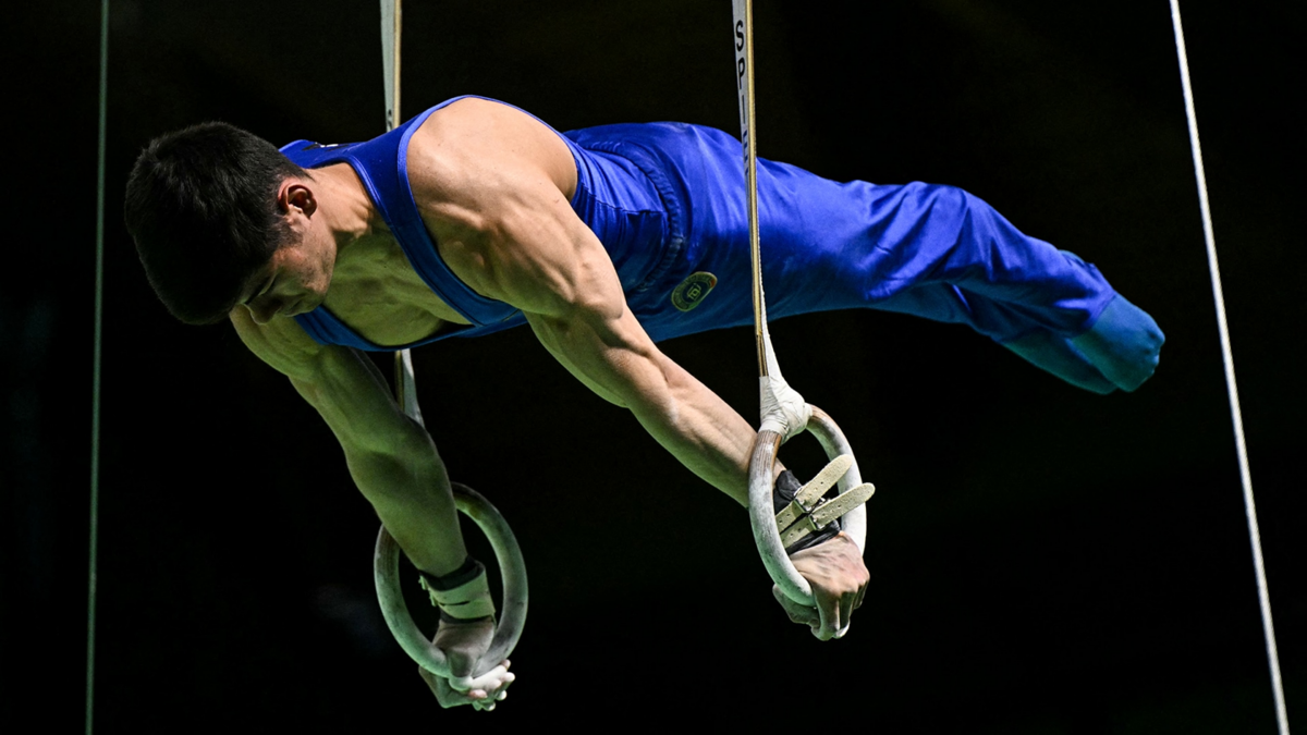 Italy's Yumin Abbadini competes in the still rings.