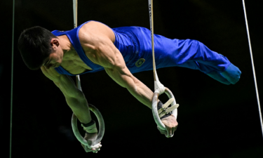 Italy's Yumin Abbadini competes in the still rings.