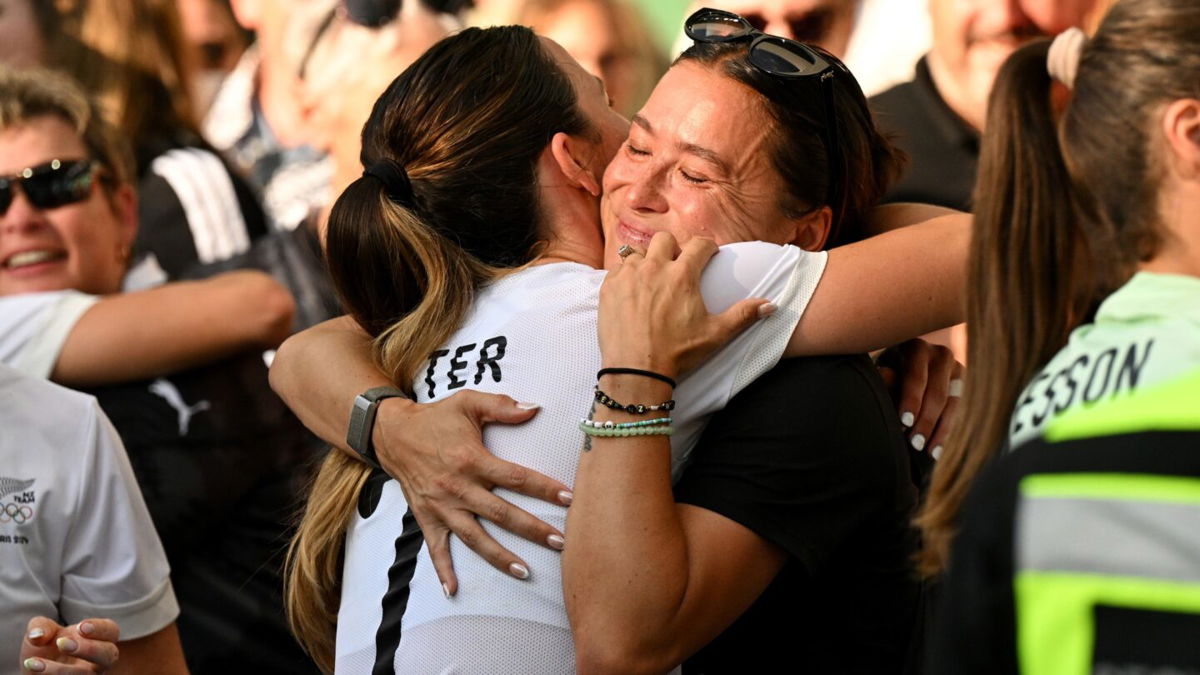 Michaela Foster and Ali Riley hug after New Zealand's match against Canada at the 2024 Paris Olympics.