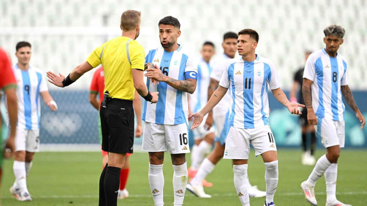 Argentina players talk to the referee.