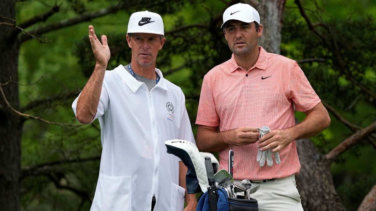 Scottie Scheffler and caddie