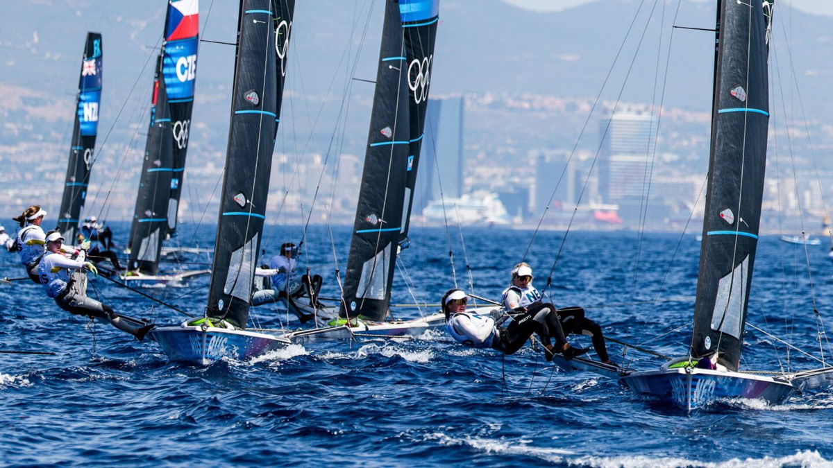 Sailors compete in windsurfing