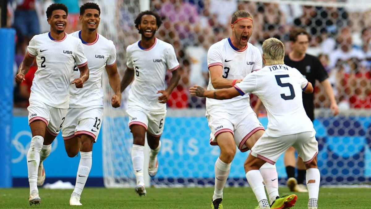 USA players celebrate after scoring a goal