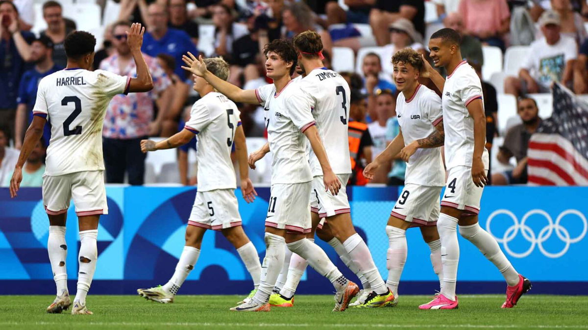 U.S. men's soccer players celebrate after scoring a goal