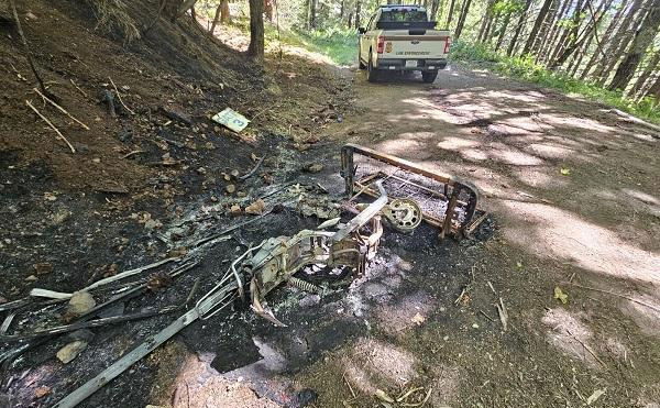 Remnants of illegal dumping someone had set on fire