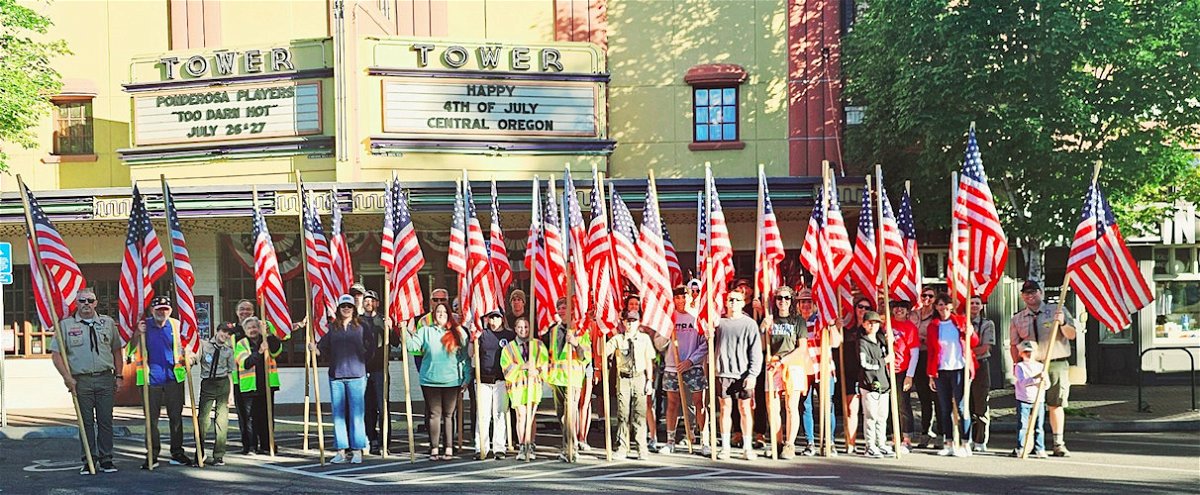 The Bend Heroes Foundation, Boy Scout Troop 25 and other volunteers helped install flags across downtown Bend on the Fourth, including the Bend Pet Parade route