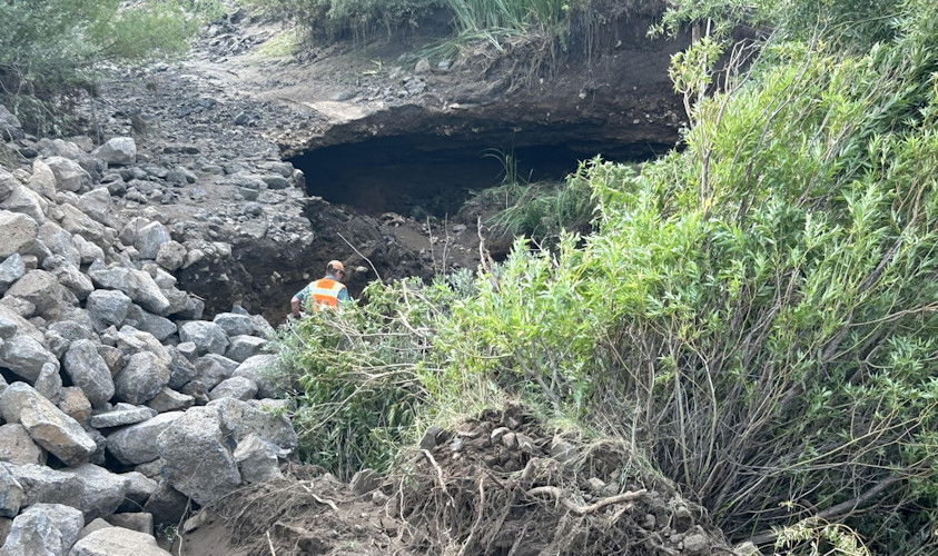 Central Oregon Irrigation District says a lava tube created a breach, 40-foot sinkhole in its canal that required shutoff of water supplies for emergency repairs