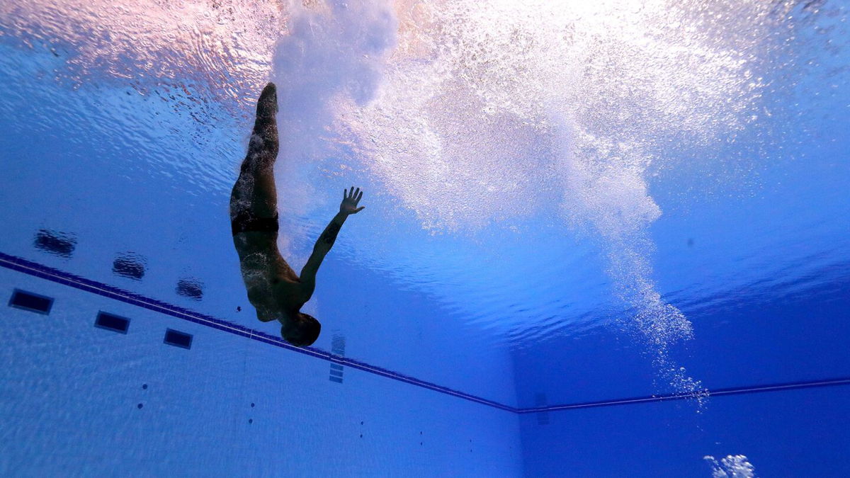 An underwater view of a diver's entry.