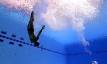 An underwater view of a diver's entry.