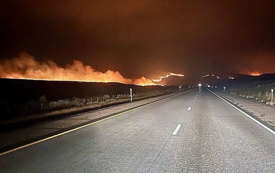 A wildfire burns along I-84 near Huntington in Eastern Oregon.