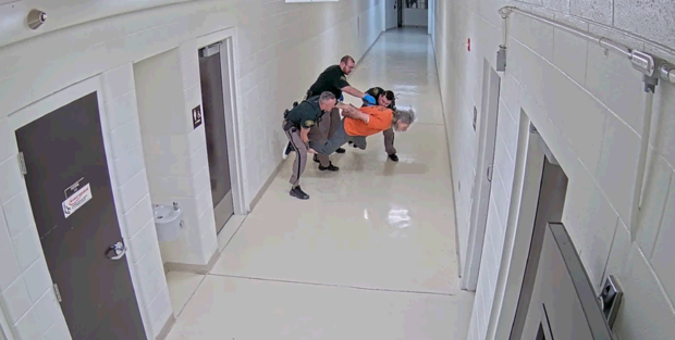 <i>Jefferson County Sheriff's Office/ KCNC via CNN Newsource</i><br/>Deputies attempting to get Fisk to knees so he could be transported by wheelchair to the next unit