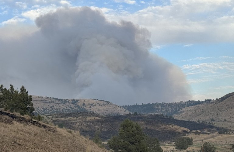 Lone Rock Fire puts up large smoke plume.